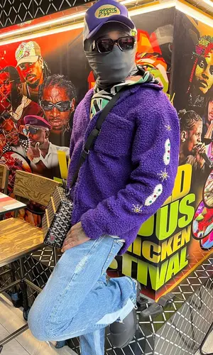 Quavo wearing Global Currency hat
