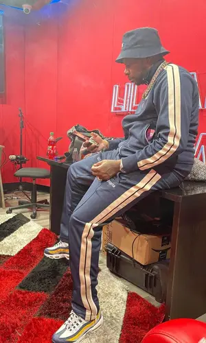 Lil Duke’s Outfit in Palm Angels Jacket, Nike Sneakers & Celine Hat (2022)