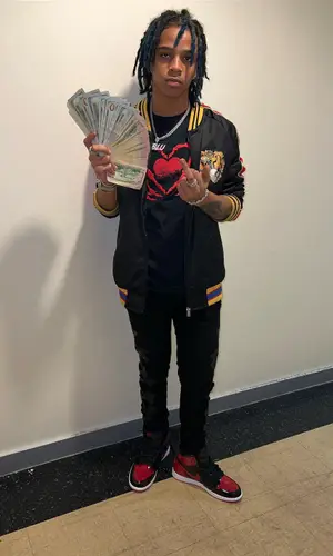 C Blu wearing Gucci jacket