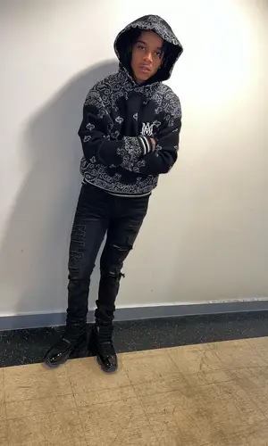 C Blu wearing Amiri t-shirt