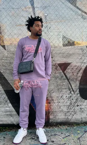 ASAP Ant wearing Louis Vuitton bag