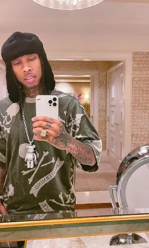 Tyga wearing Mastermind hat