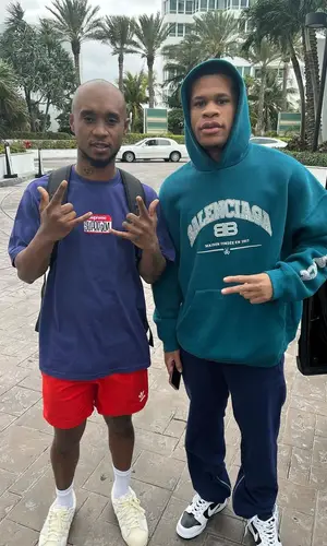 Slim Jxmmi wearing Adidas sneakers