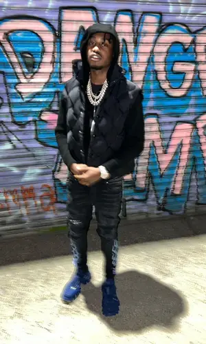 Lil Tjay wearing Bottega Veneta jacket