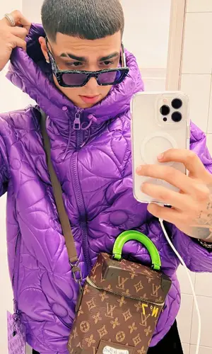 Lunay wearing Louis Vuitton jacket
