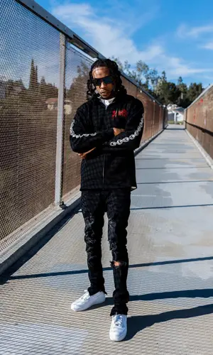 Chris Travis wearing FashionNova hoody