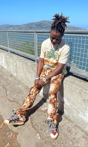 Jackboy wearing Amiri trousers