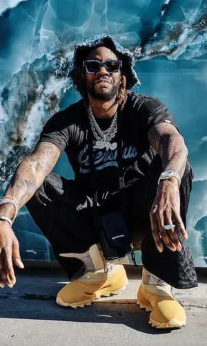 2 Chainz wearing Louis Vuitton hat
