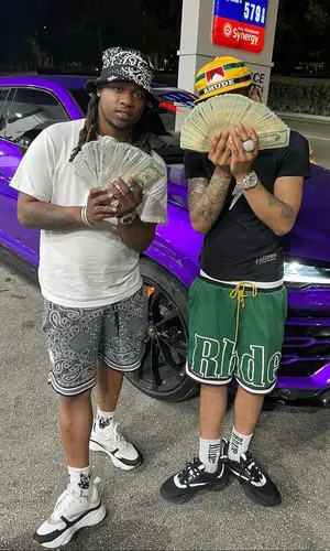 Lil Migo wearing Rhude sock