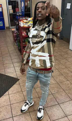Rico Recklezz wearing Burberry belt