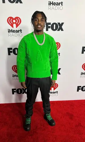 Lil Tjay wearing Bottega Veneta boots