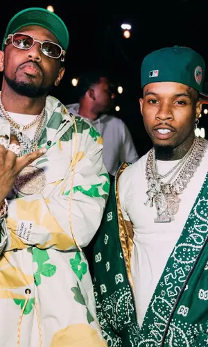 Tory Lanez wearing Rhude pants