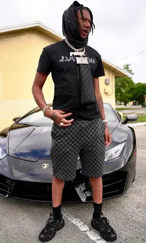 Digga D wearing Louis Vuitton t-shirt