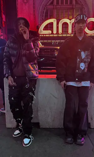Dro Kenji wearing Nike sneakers