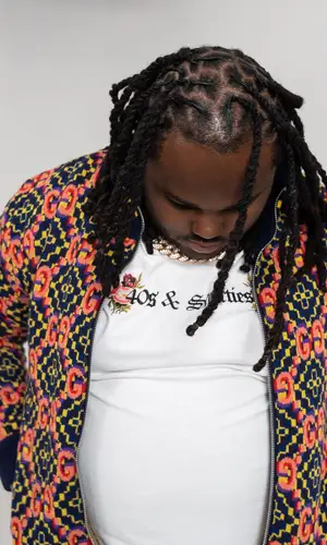 Tee Grizzley wearing 40s & Shorties t-shirt