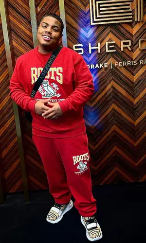 Smiley wearing Burberry sneakers