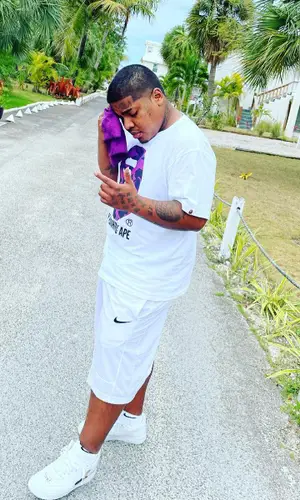 Smiley wearing Nike shorts
