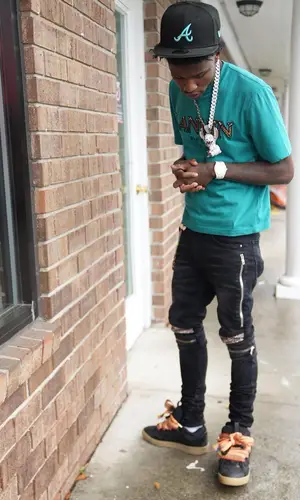 Quando Rondo wearing Balenciaga belt