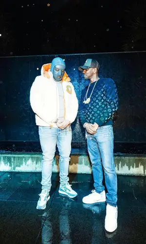 M Huncho wearing Amiri jeans