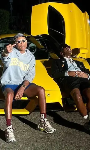 Pharrell Williams wearing Noah shorts