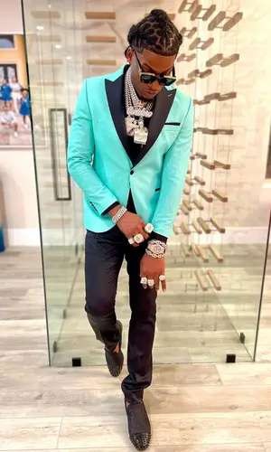 CJ So Cool wearing Dolce & Gabbana pants