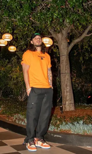 Russ wearing Heron Preston cap