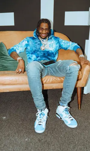 Russ Millions wearing Dior belt