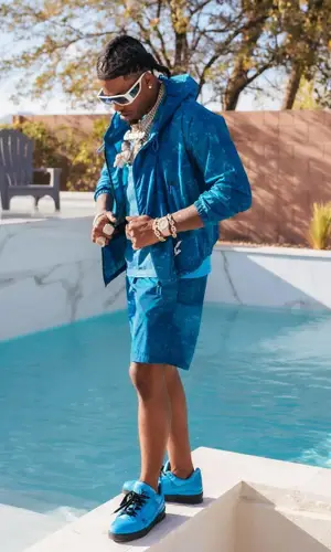 CJ So Cool wearing Louis Vuitton swimwear