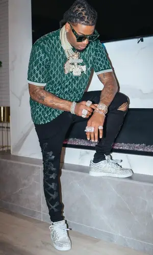 CJ So Cool wearing Gucci shirt