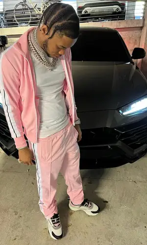 Lil Migo wearing Palm Angels jacket