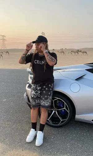 Reggie Mills wearing Celine t-shirt