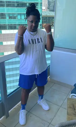 Tay Keith’s Outfit in Amiri T-Shirt, Nike Sneakers & Cartier Eyewear (2022)