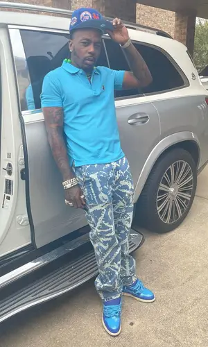 Sauce Walka wearing New Era cap