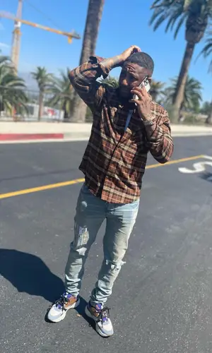 Jermaine wearing Dior sneakers
