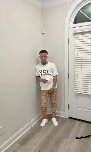 SG Tip wearing Amiri jeans