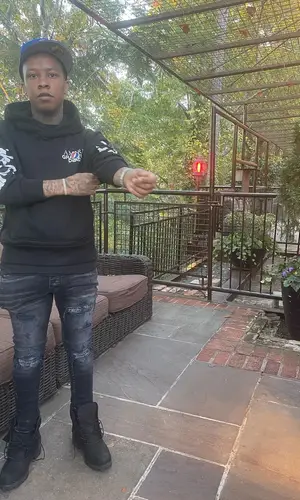 SG Tip wearing Timberland boots