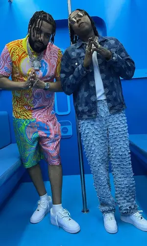 French Montana wearing Versace shirt