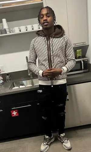 Lil Tjay wearing Amiri jeans