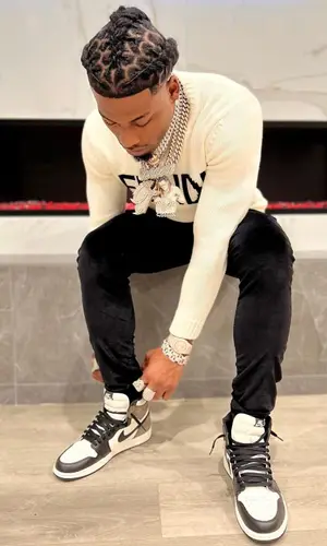 CJ So Cool wearing Amiri pants
