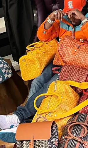 Takeoff’s Outfit in The North Face Jacket, Louis Vuitton Bag & Goyard Backpack (2022)