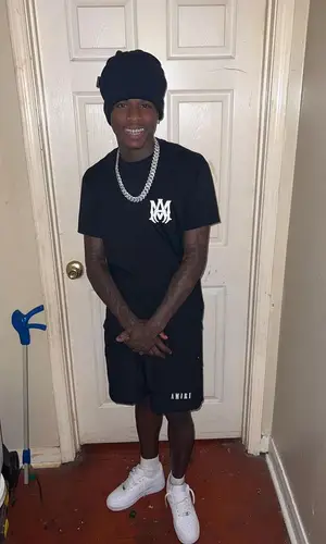 Quando Rondo wearing Amiri shorts