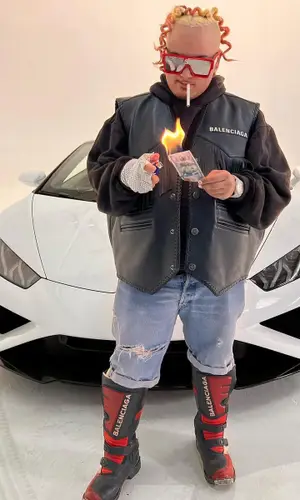 Nessly wearing Balenciaga boots
