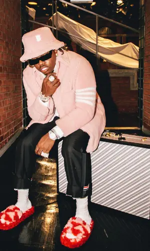 Gunna wearing Thom Browne jacket