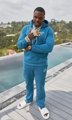 BandMan Kevo wearing Louis Vuitton pants