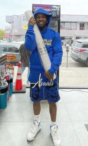 Tory Lanez wearing Awful Lot of Cough Syrup hoody
