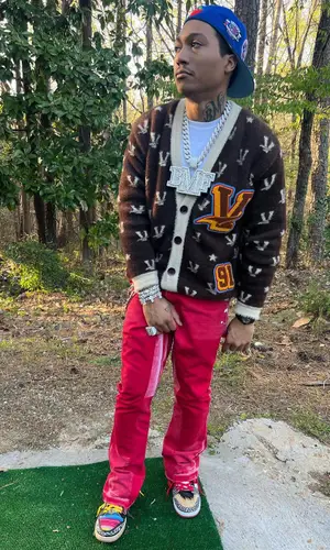 Lil Meech wearing Vicieux sweater