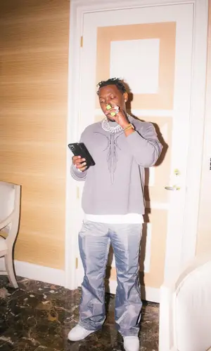 HitBoy’s Outfit in Code Sweater & Louis Vuitton Sneakers (2022)