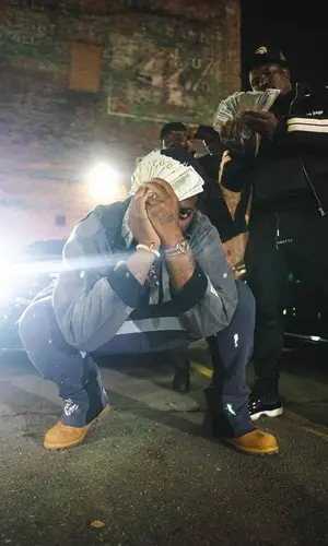 Peezy wearing Timberland boots