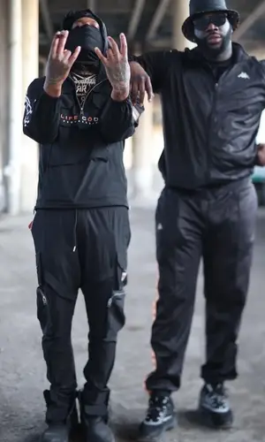 Rico Recklezz wearing Life Code jacket