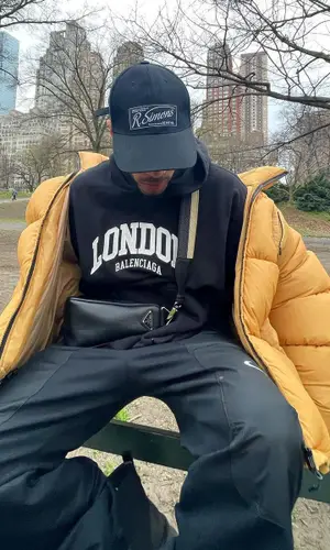 Rauw Alejandro wearing Prada bag